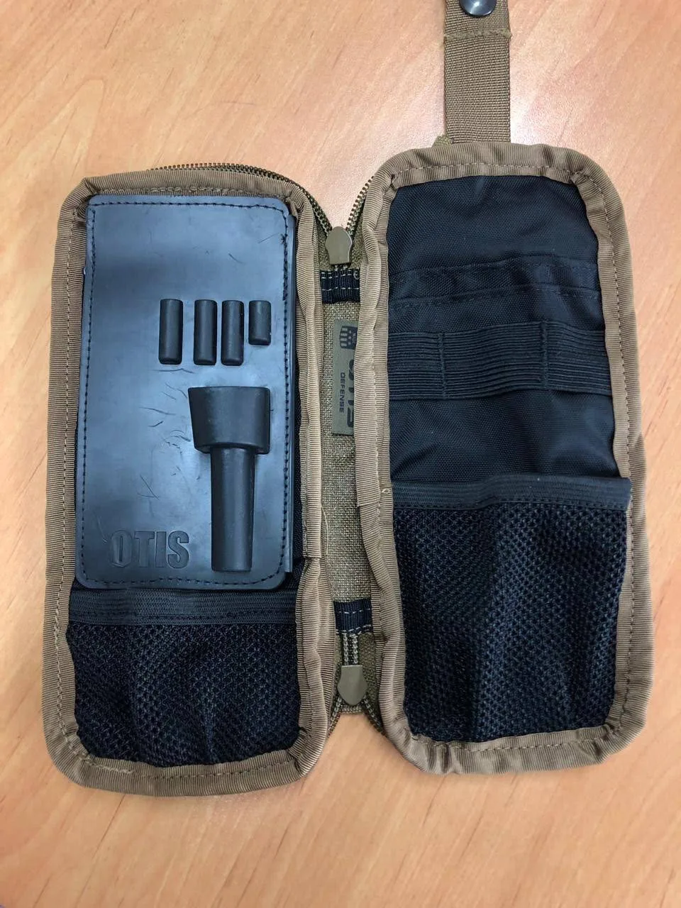 A finished tactical pouch with webbing and hook-and-loop