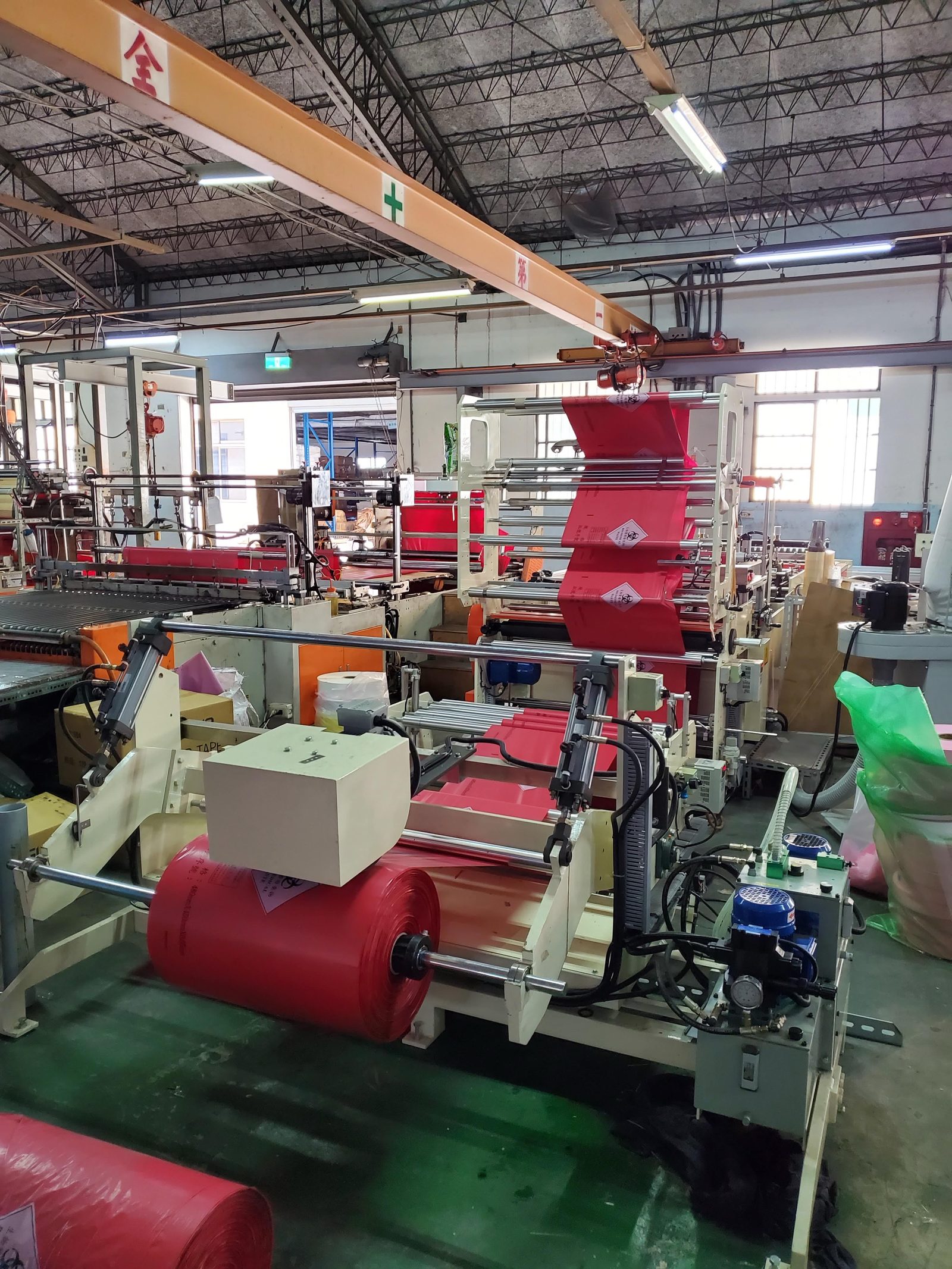 A bag-making line converting printed red film into bags