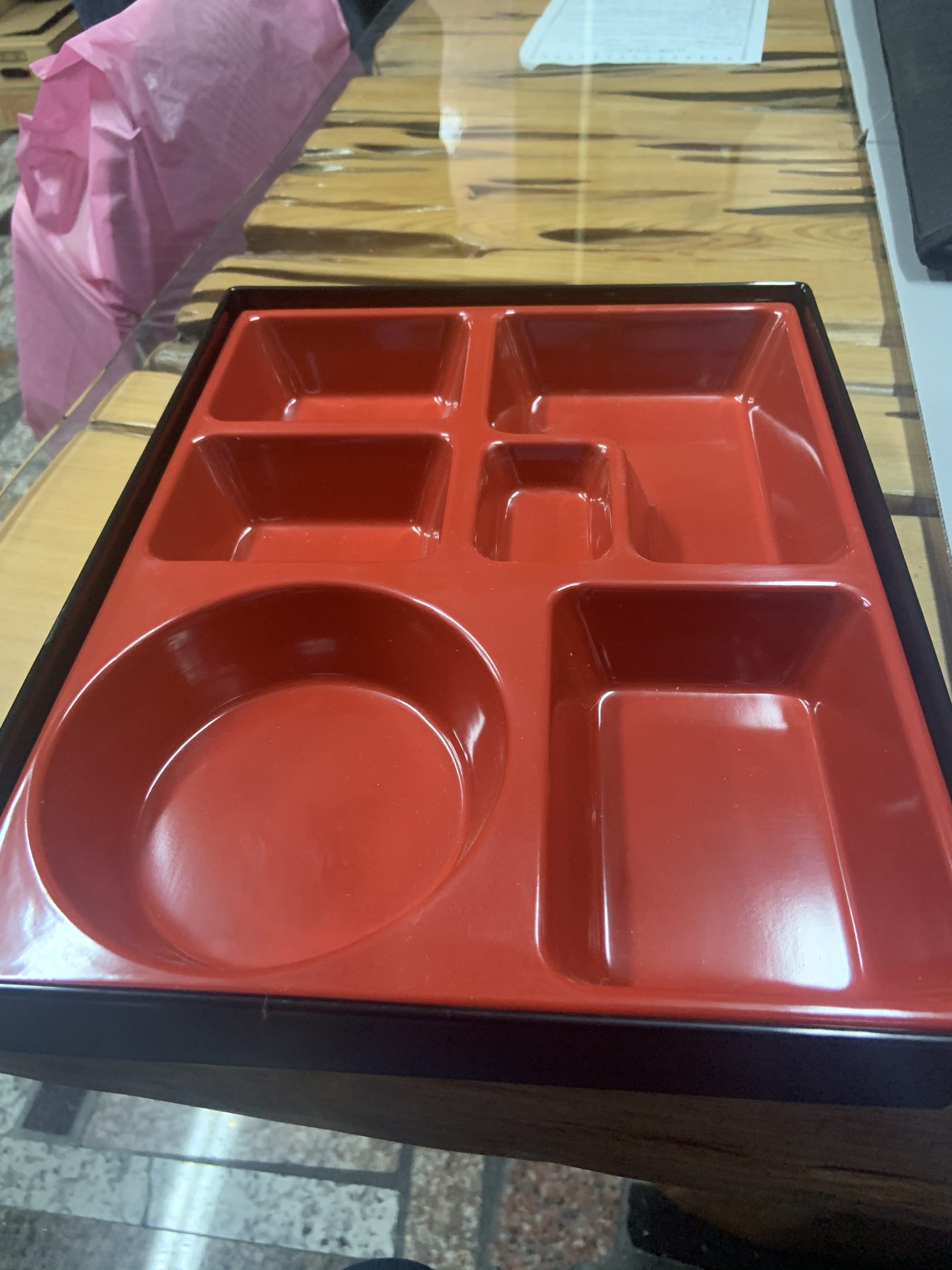 A red molded compartment tray kept as the approved golden sample for later production lots