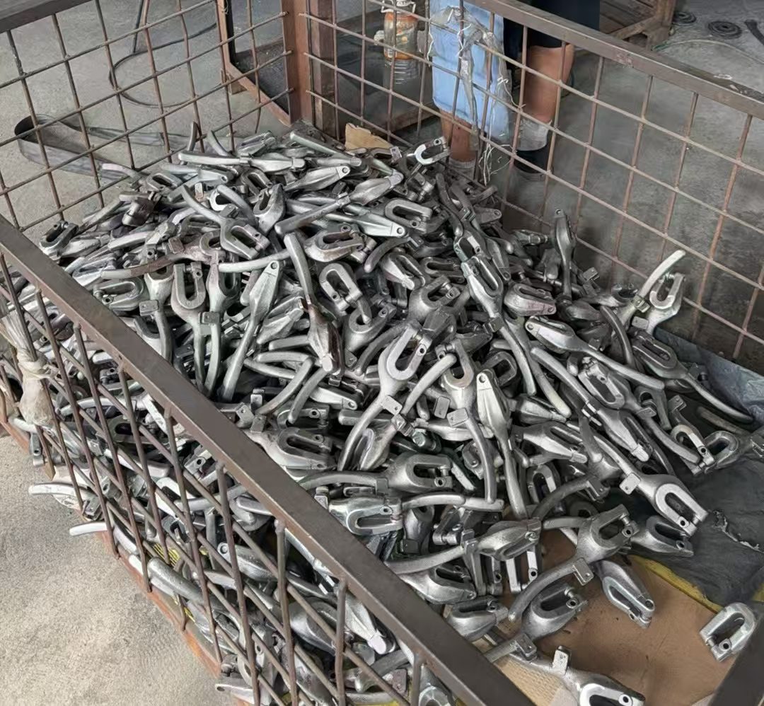 A wire bin full of rough metal castings waiting for the next operation