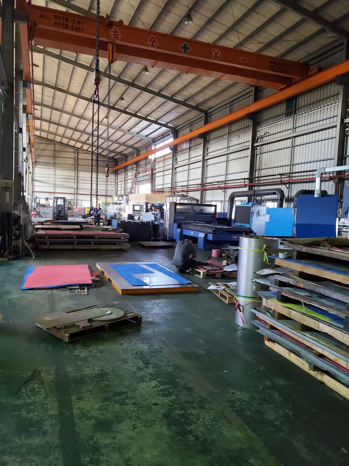 Material staged in a bay — foam, sheet, the next run.