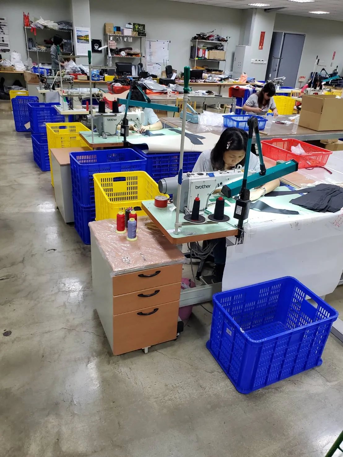 Assembly benches with parts bins and work-in-progress laid out along the line.