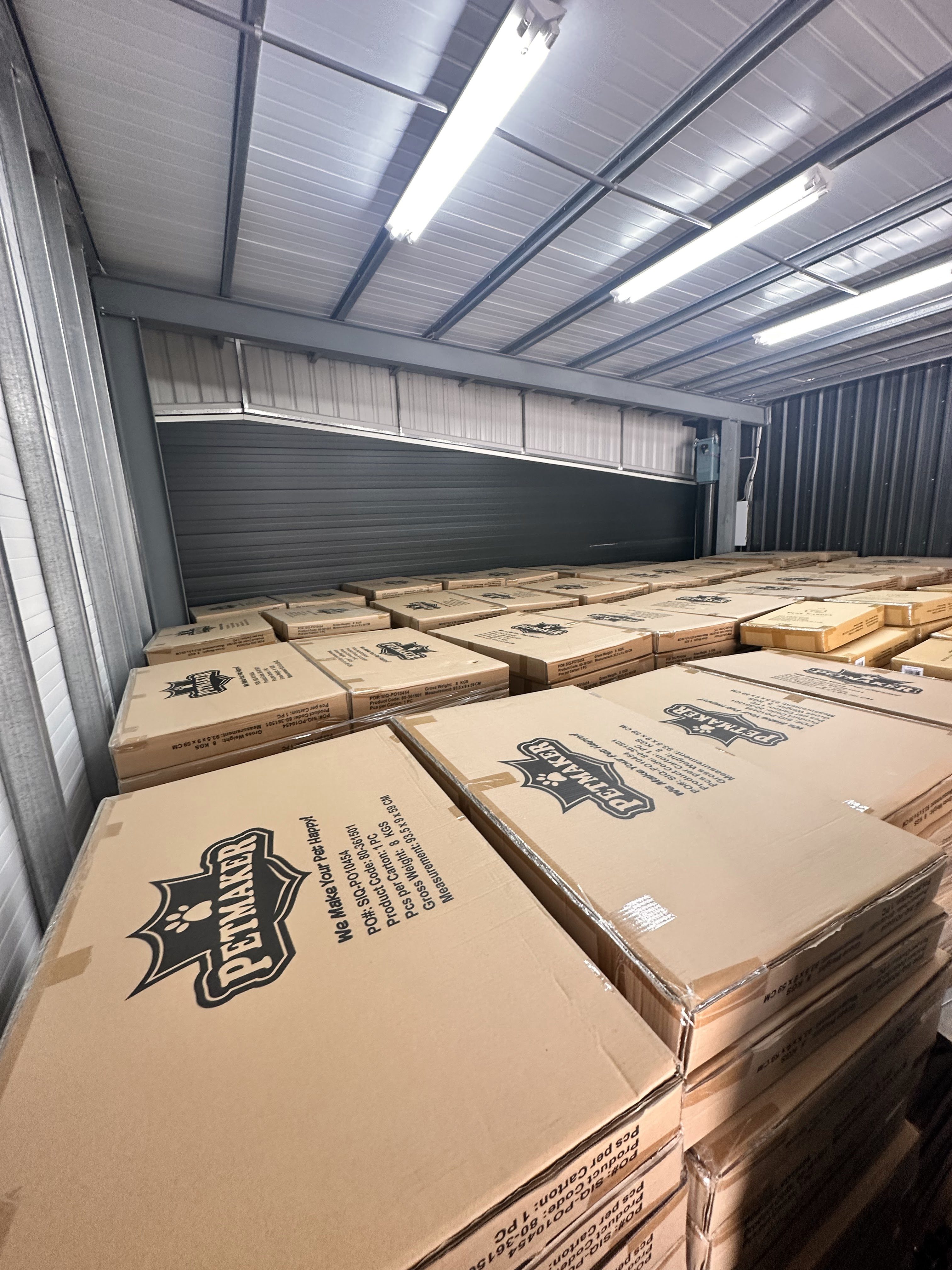Cartons staged at origin — a program in volume.