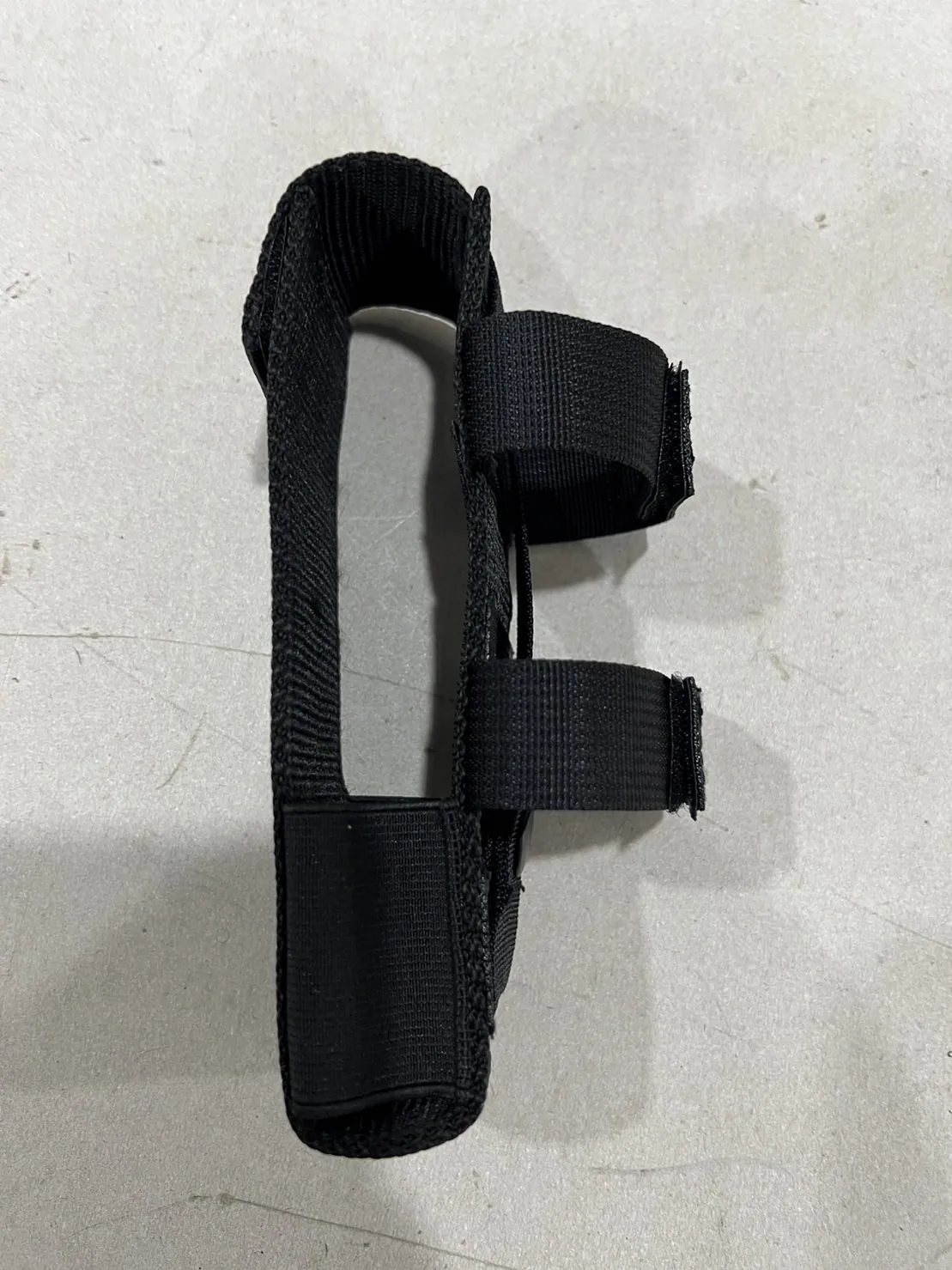 The same item showing the strap layout and stitching.