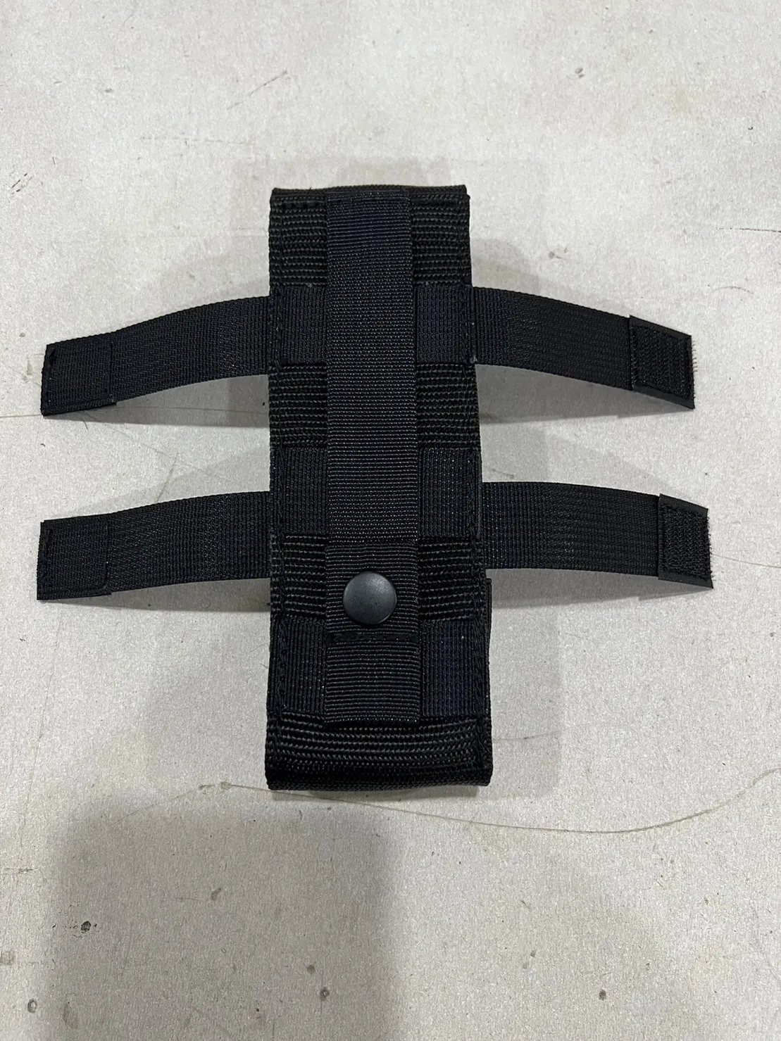 Reverse face, with the attachment straps set out.