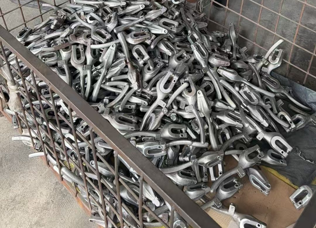 Cast yokes in a stillage, mid-production.