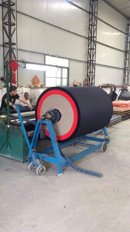 A fabric coating line with a large roll