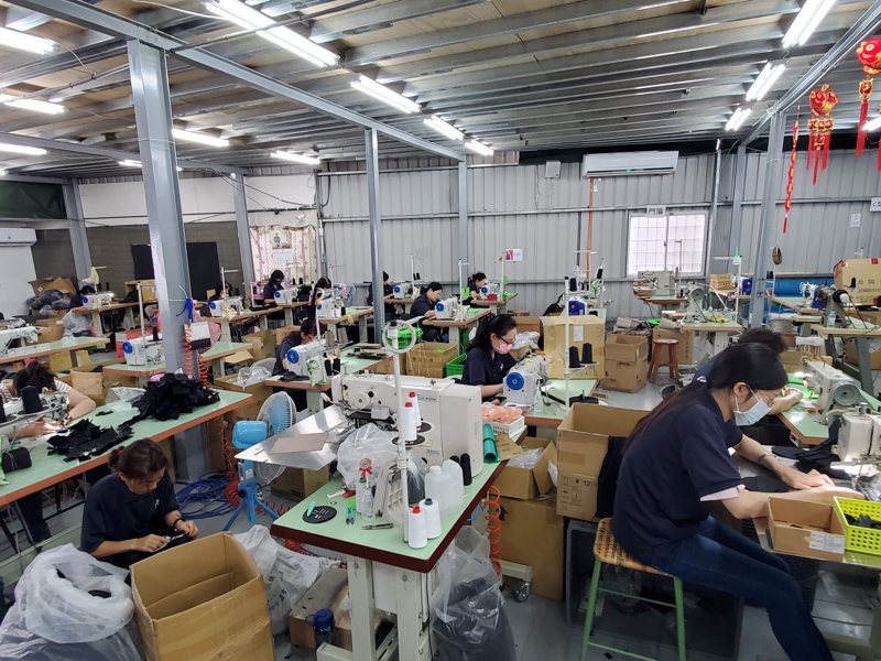 Sewing operators assembling bags at their stations
