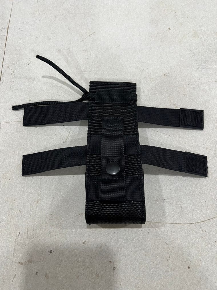 A black nylon pouch with webbing straps