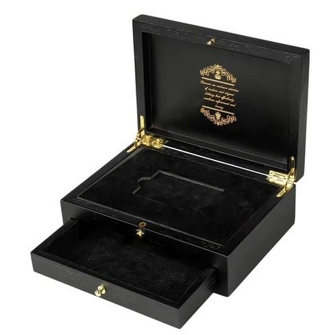 A black lacquer presentation case with a gold-printed lid, open, with a fitted interior