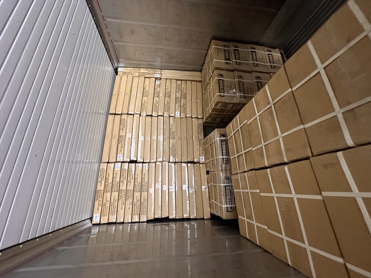 Cartons loaded into a shipping container