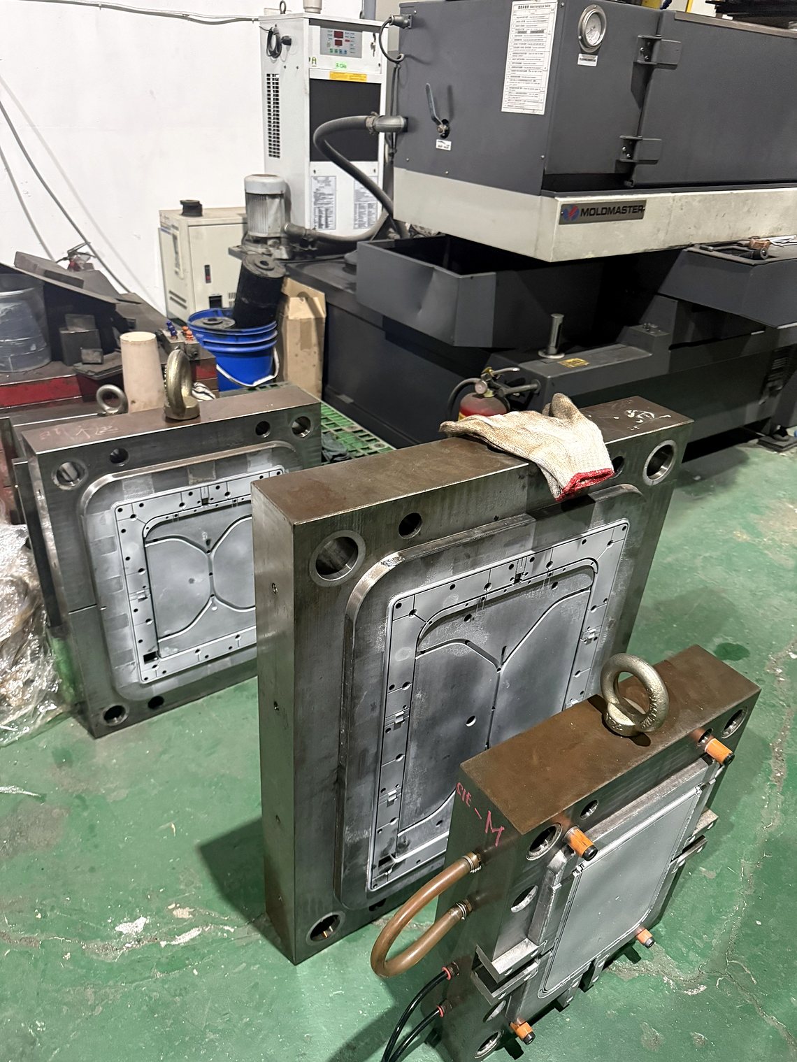 A tool beside the EDM, the machine that burns the fine detail.
