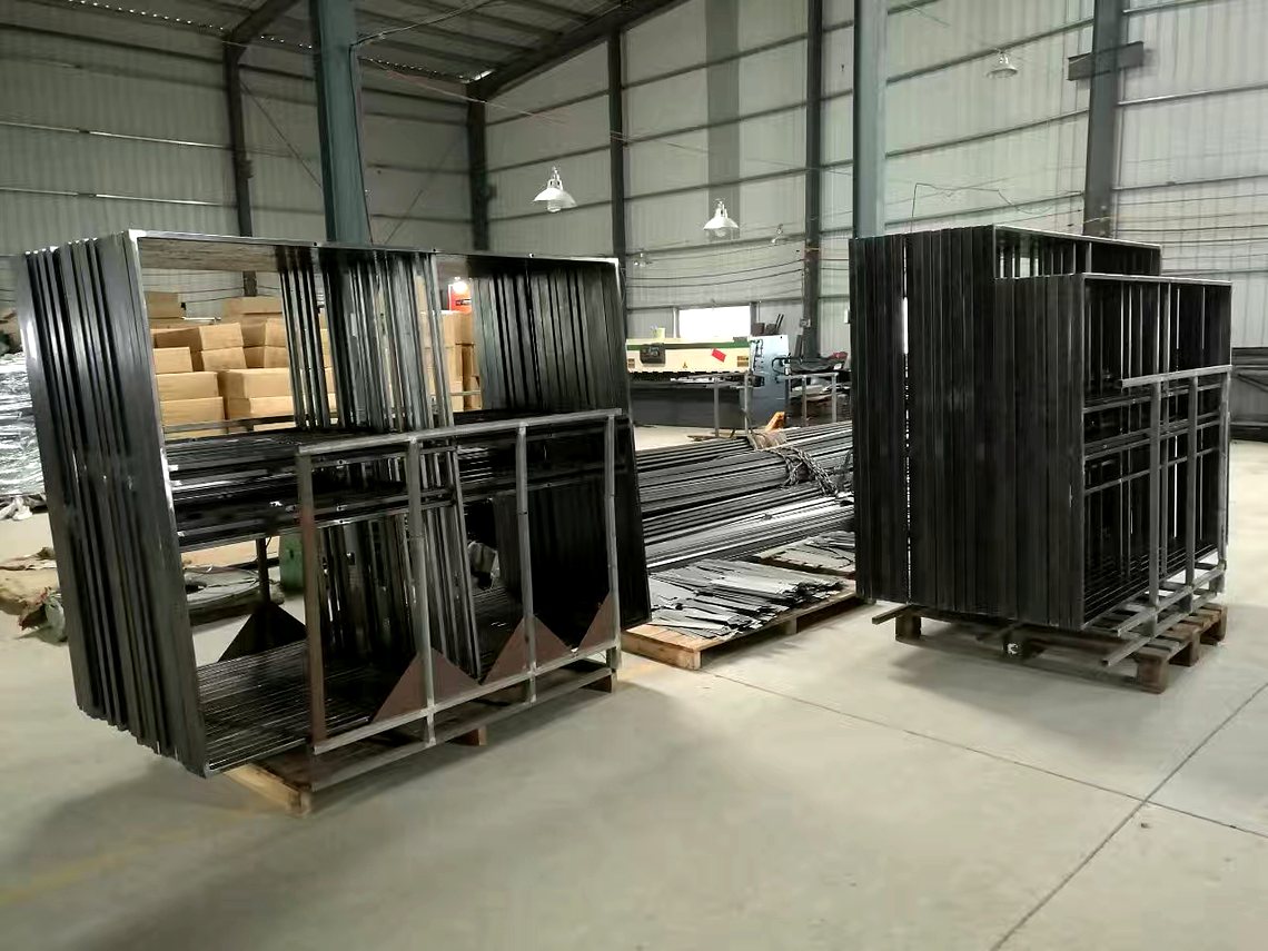 Welded frames staged by the line.