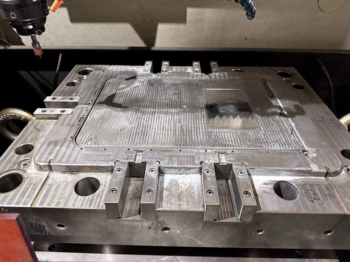 A base under the machine, pocket and slide seats down.